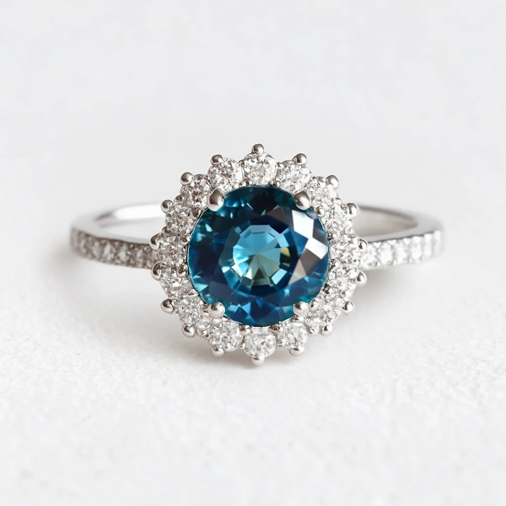 Stella's Spark | Vintage Blue Sapphire Diamond Halo Engagement Ring