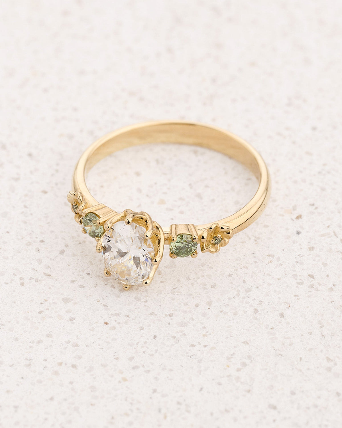 Flower-Inspired Engagement Ring with Oval Diamond and Green Diamond Accents / Fiorella