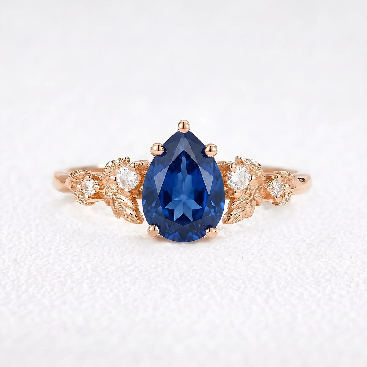 Daisy’s Twilight | 1.5CT Pear Cut Blue Sapphire Engagement Ring