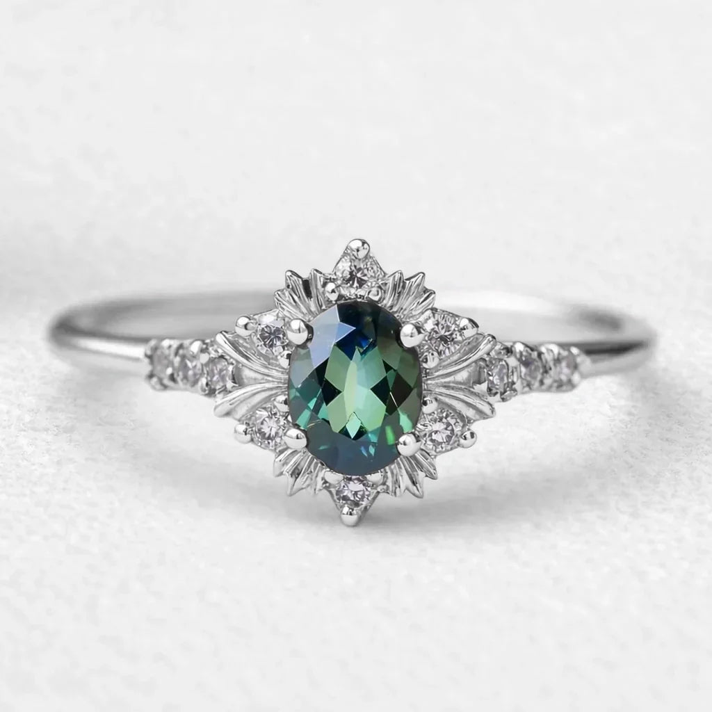 Alexandra’s Verdure | Vintage Oval Emerald Halo Engagement Ring