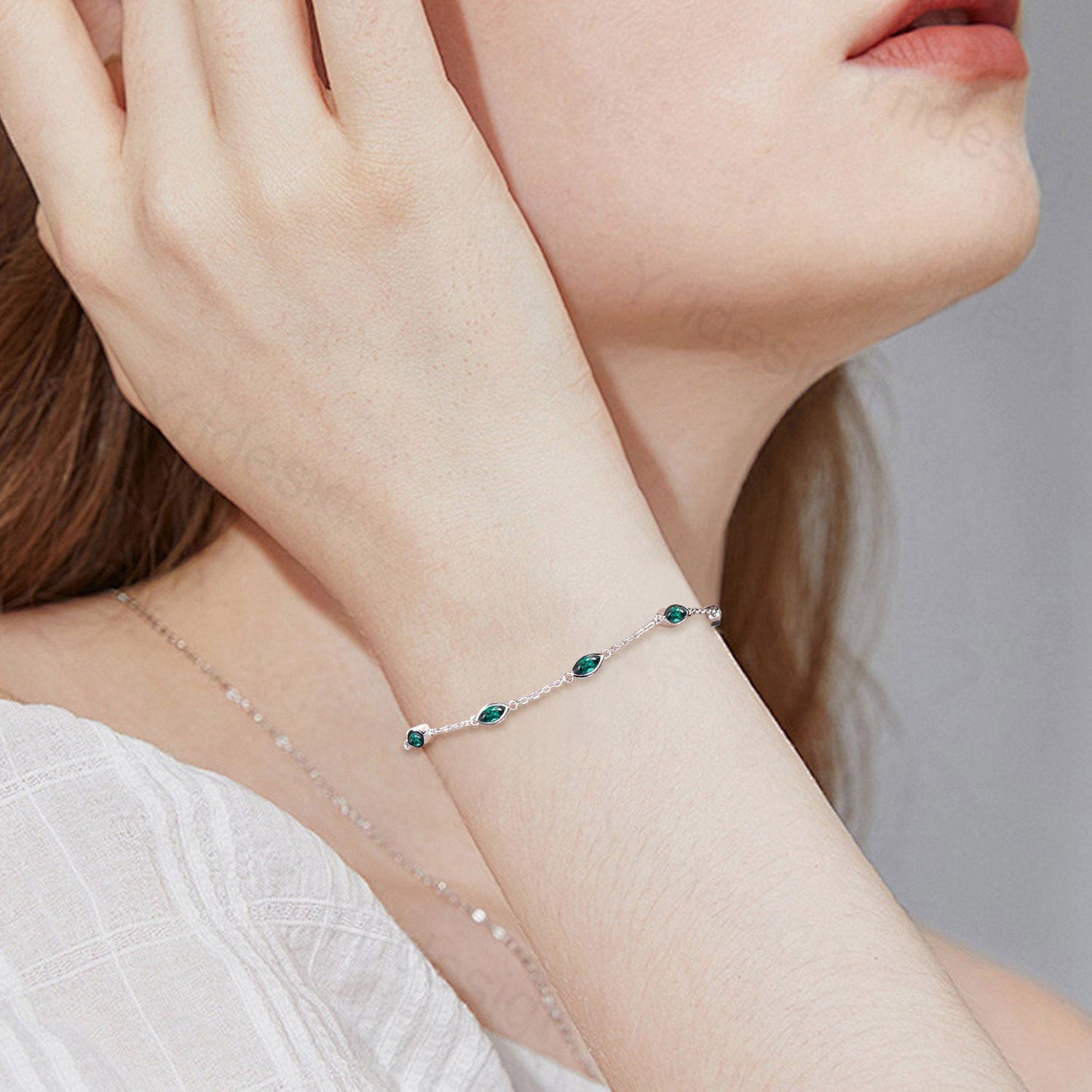 Dainty marquise cut Emerald bracelet bezel set