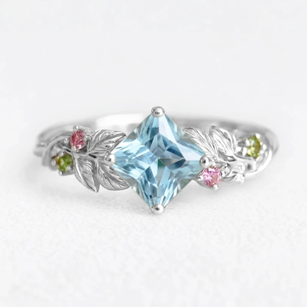 Cressida’s Stillness | Clear Blue Aquamarine Leafy Engagement Ring