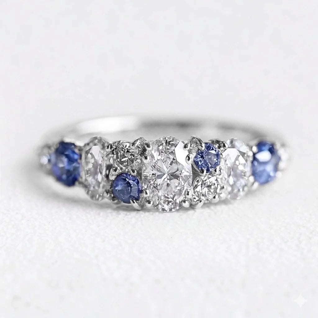 Cordelia’s Keepsake | Thistle Blue Sapphire & Moissanite Half‑Eternity Ring