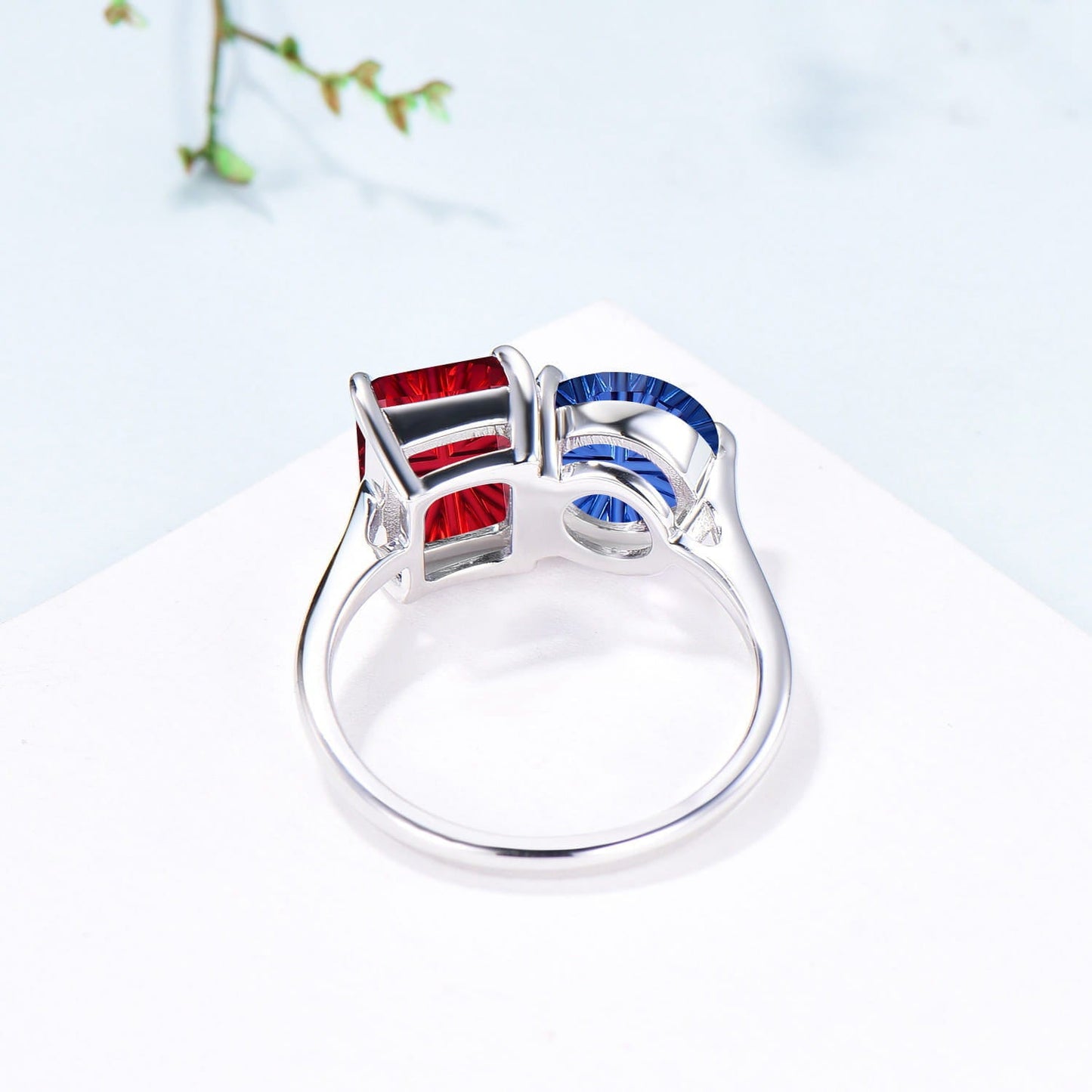 You and Me | Starburst Emerald Cut Blue Sapphire and Round Red Ruby Toi et Moi Engagement Ring