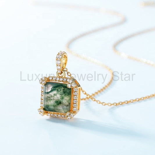Angled side view of a square green-patterned pendant showing the raised gold-tone frame and clear