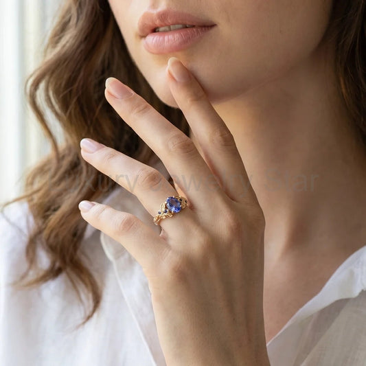 Aria‘s Glade | 1.5CT Oval Cut Tanzanite & Blue Sapphire Leaf Engagement Ring