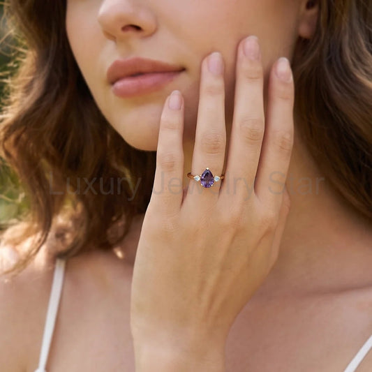 Selene’s Mirage | Pear Tanzanite & Moonstone Engagement Ring