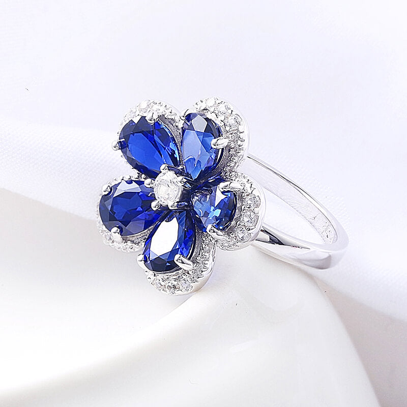 Five Petal Halo Pear Sapphire Flower Ring In Sterling Silver