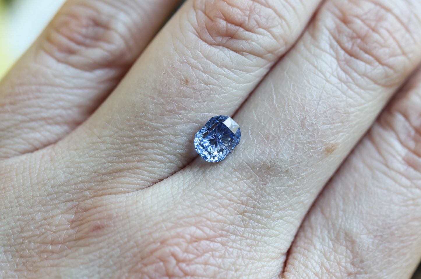 1.97ct oval blue sapphire, Fantasy cut by Fellowship Forge