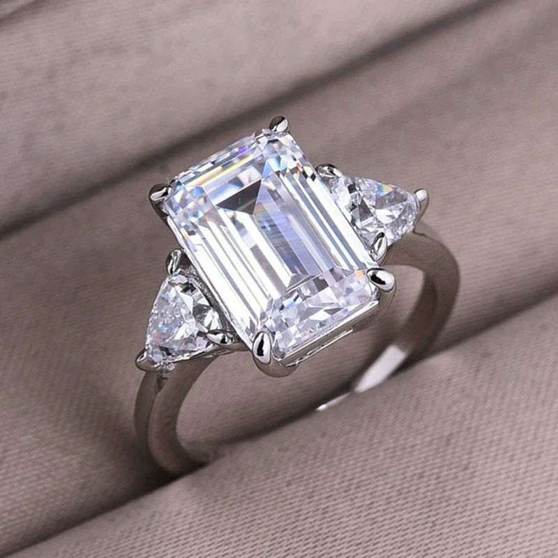 Deluxe Emerald Cut 7.5ct Three Stone Engagement Ring In Sterling Silver