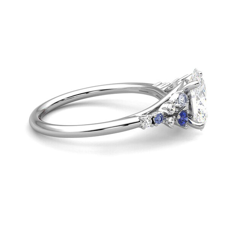Oval Moissanite And Graduated Blue Sapphire Clusters Engagement Ring