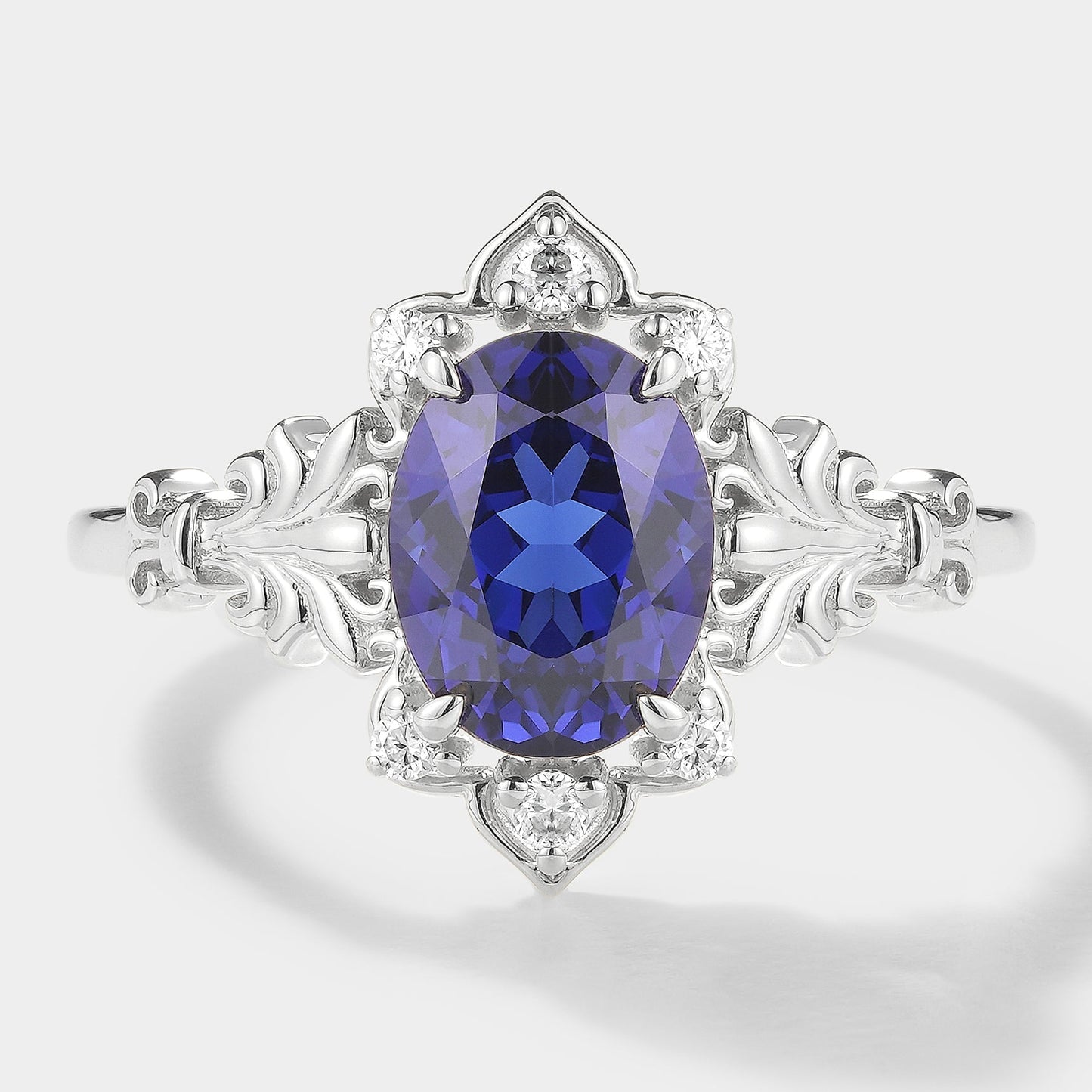 Oval Cut Royal Blue Sapphire Engagement Ring With Iris