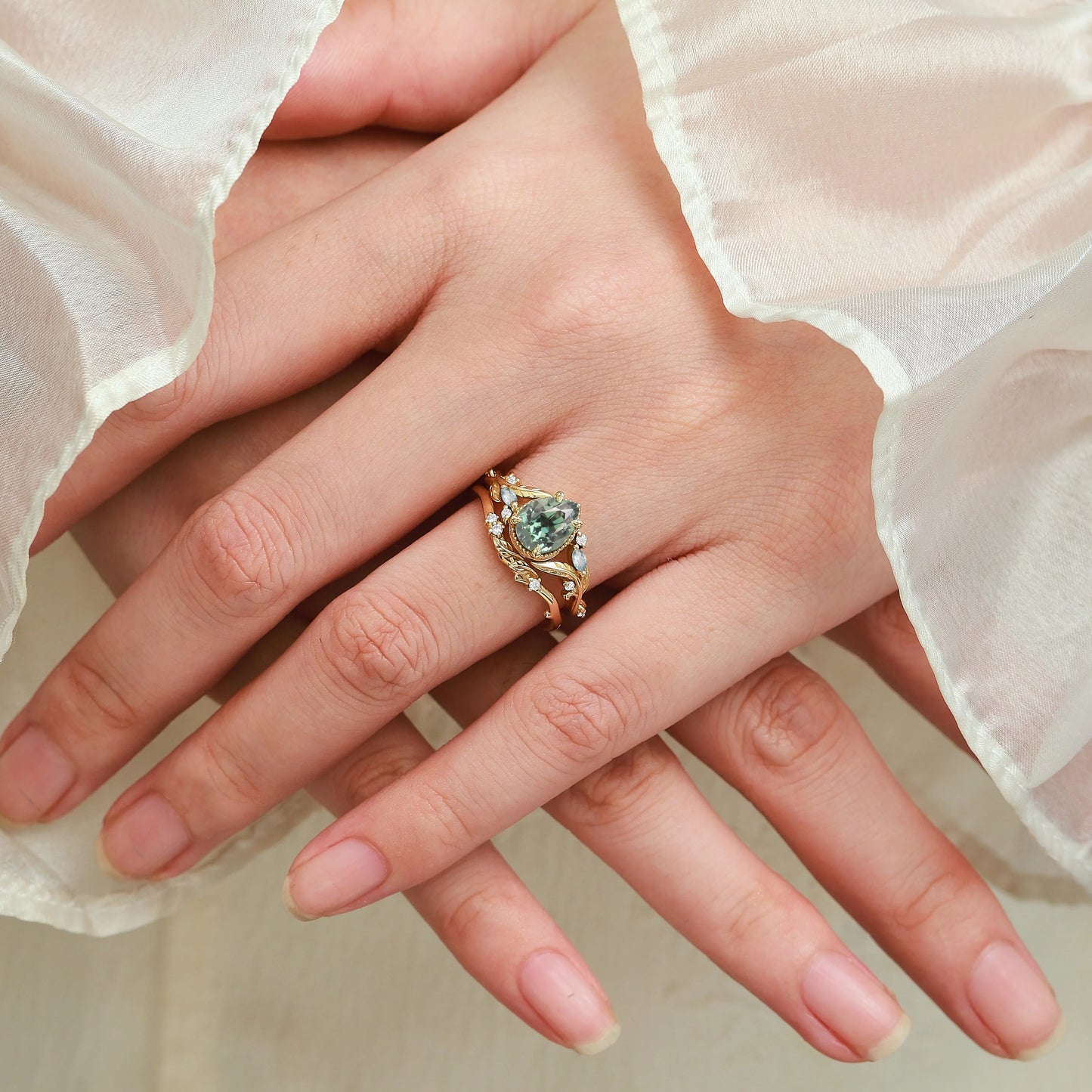 Nature-Inspired Leaf Vintage Bezel Pear Cut Green Sapphire Bridal Set
