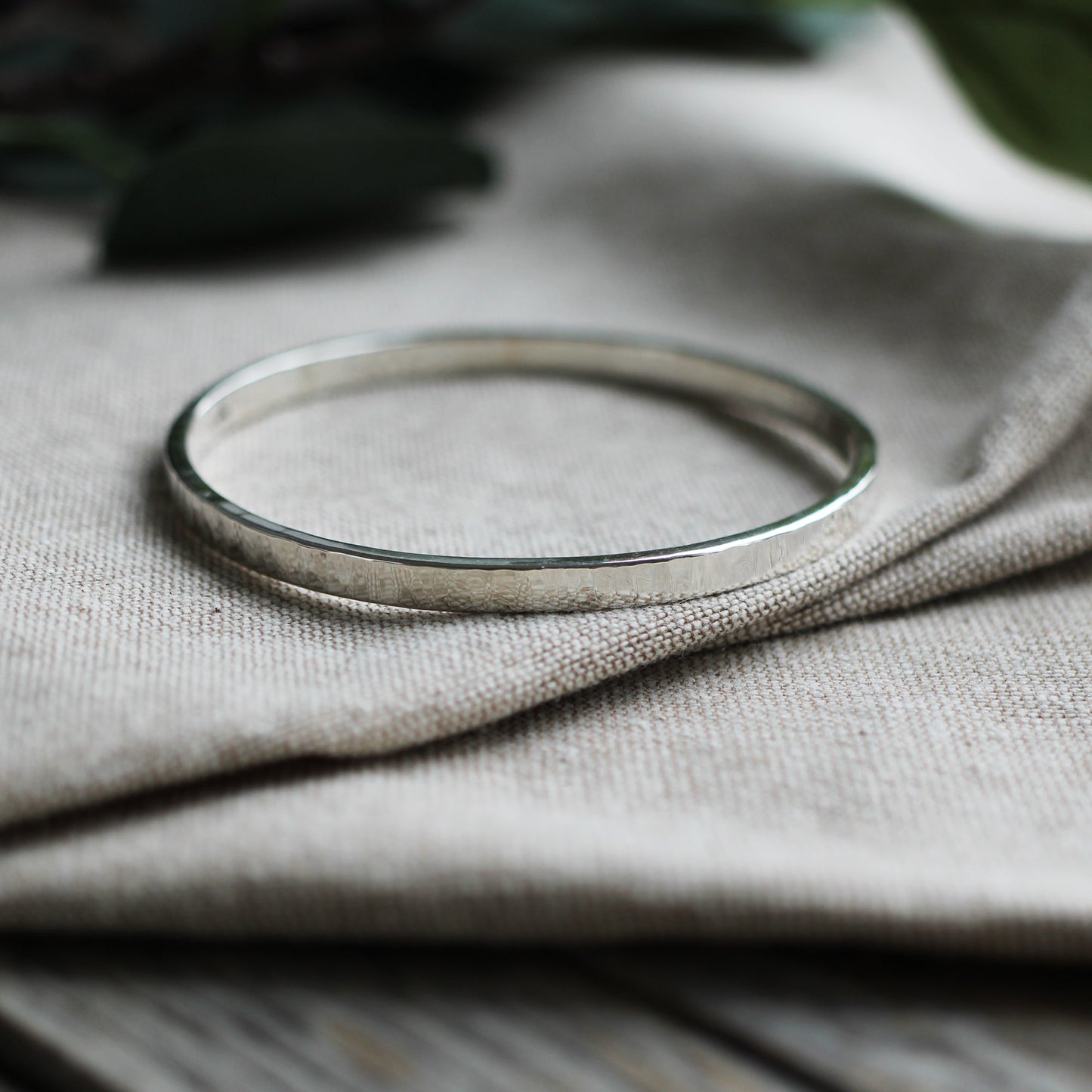 Thick hammered silver bangle