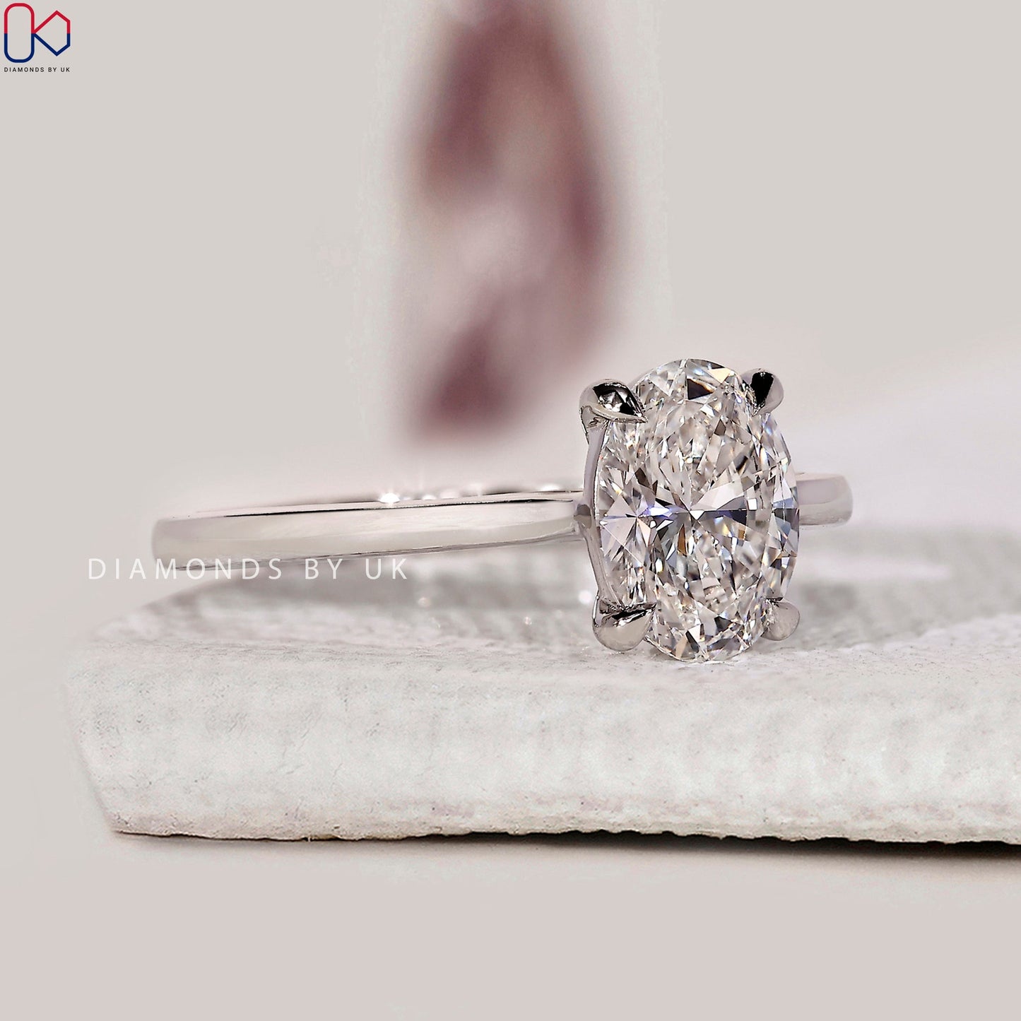 Oval Solitaire Engagement Ring With Cathedral Setting