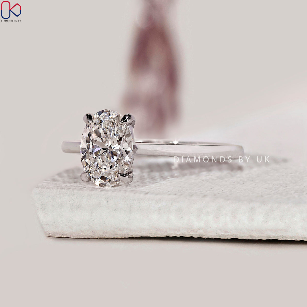 Oval Solitaire Engagement Ring With Cathedral Setting