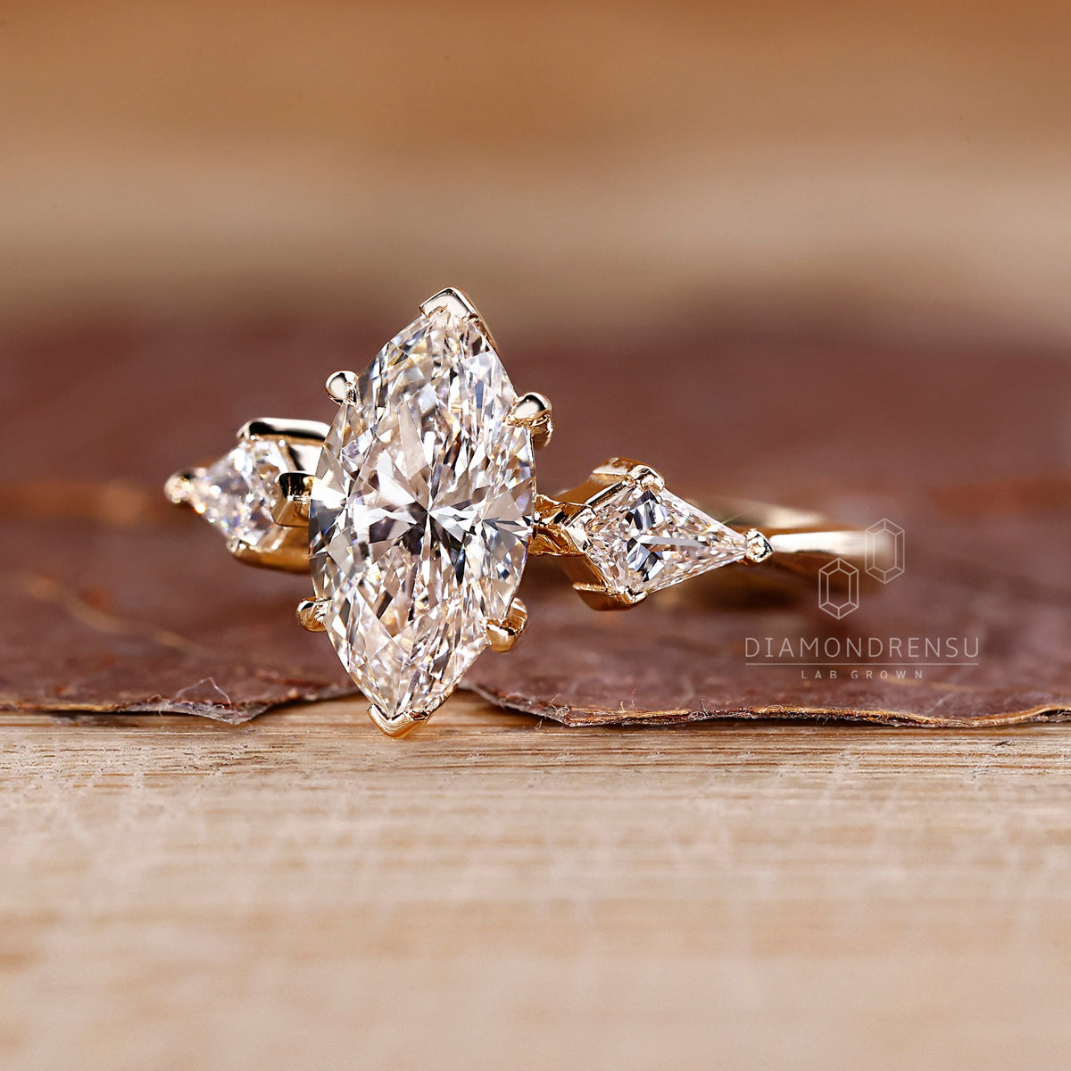 Marquise and Kite Cut Three Stone Engagement Ring