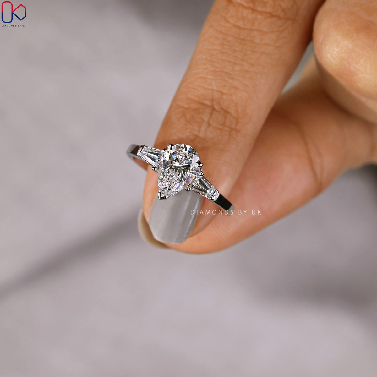 Teardrop Diamond Ring With 2 Tapered Baguette Side Stone