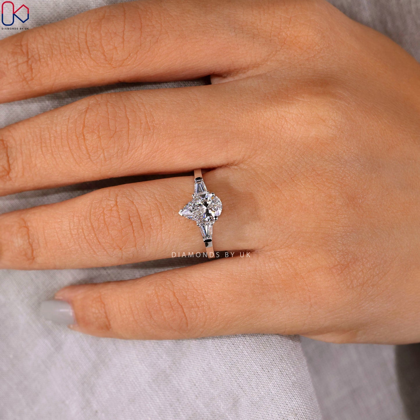 Teardrop Diamond Ring With 2 Tapered Baguette Side Stone