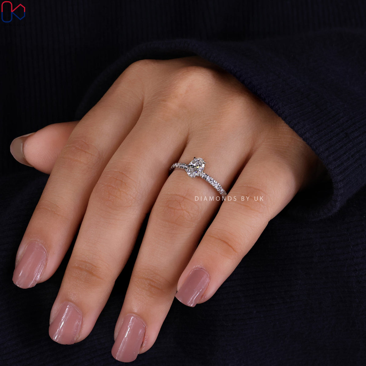 Gold Oval Diamond Engagement Ring In Pave Setting