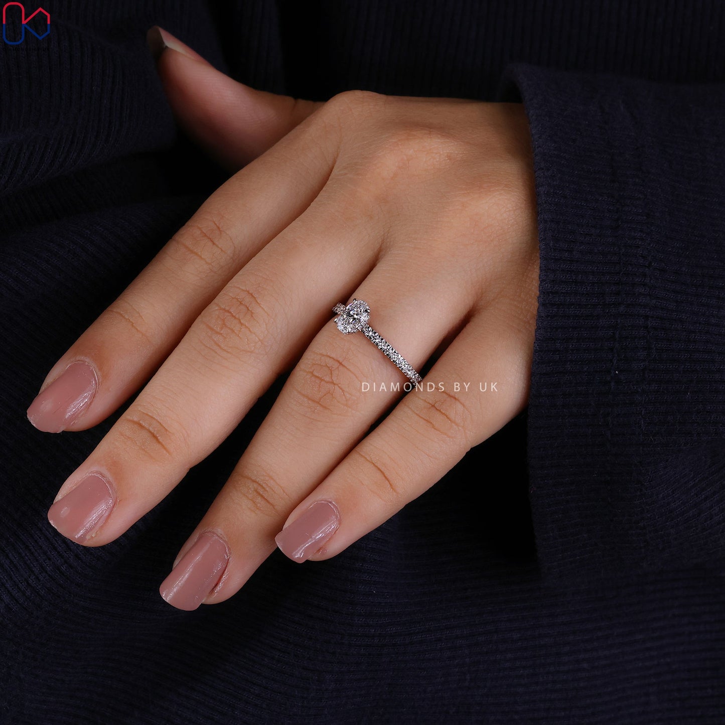 Gold Oval Diamond Engagement Ring In Pave Setting