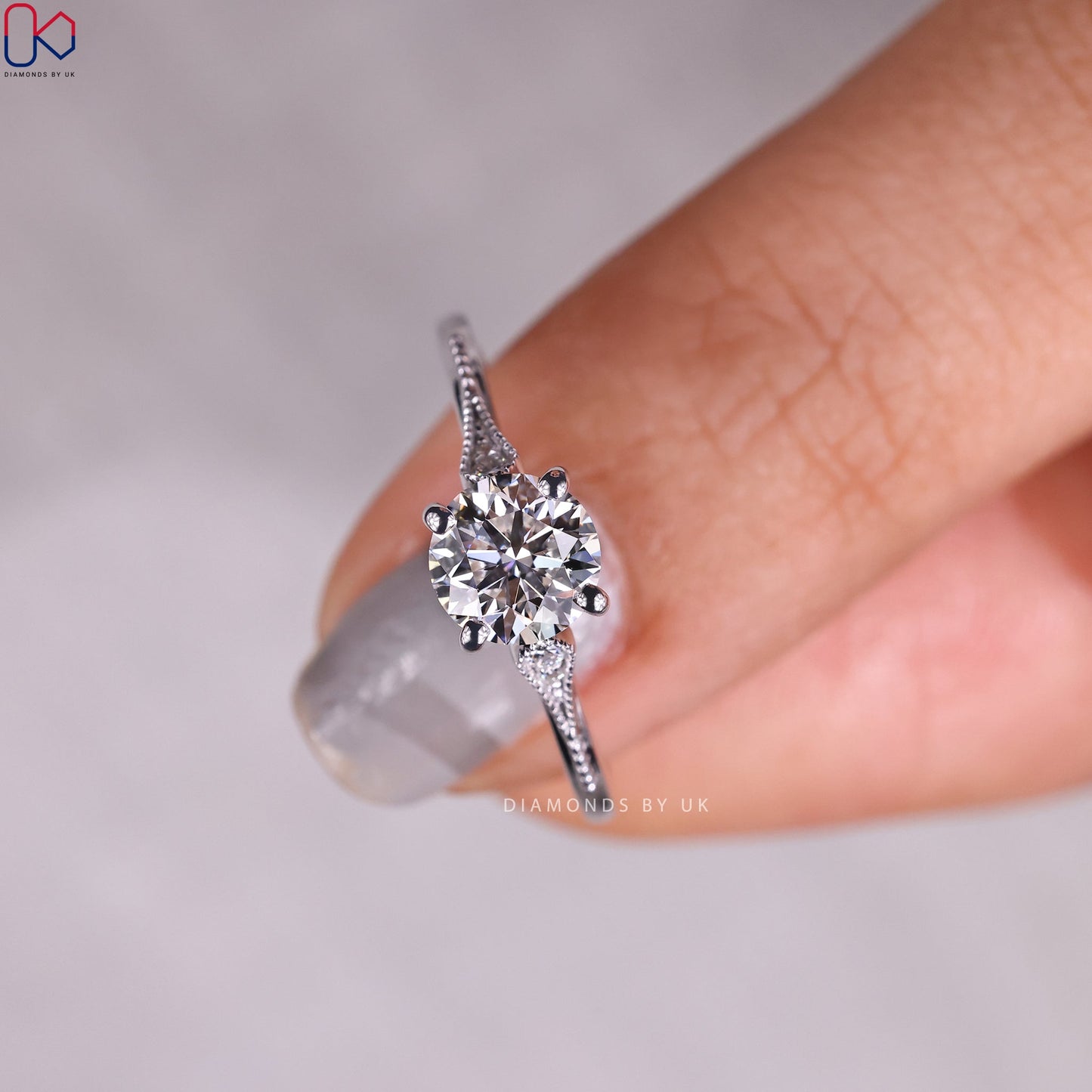 Round Diamond Side Stone Engagement Ring