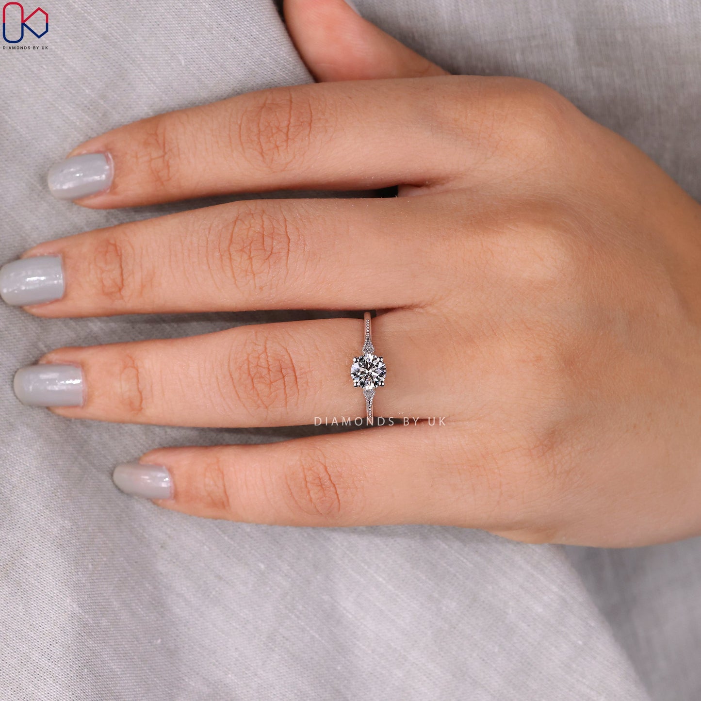 Round Diamond Side Stone Engagement Ring