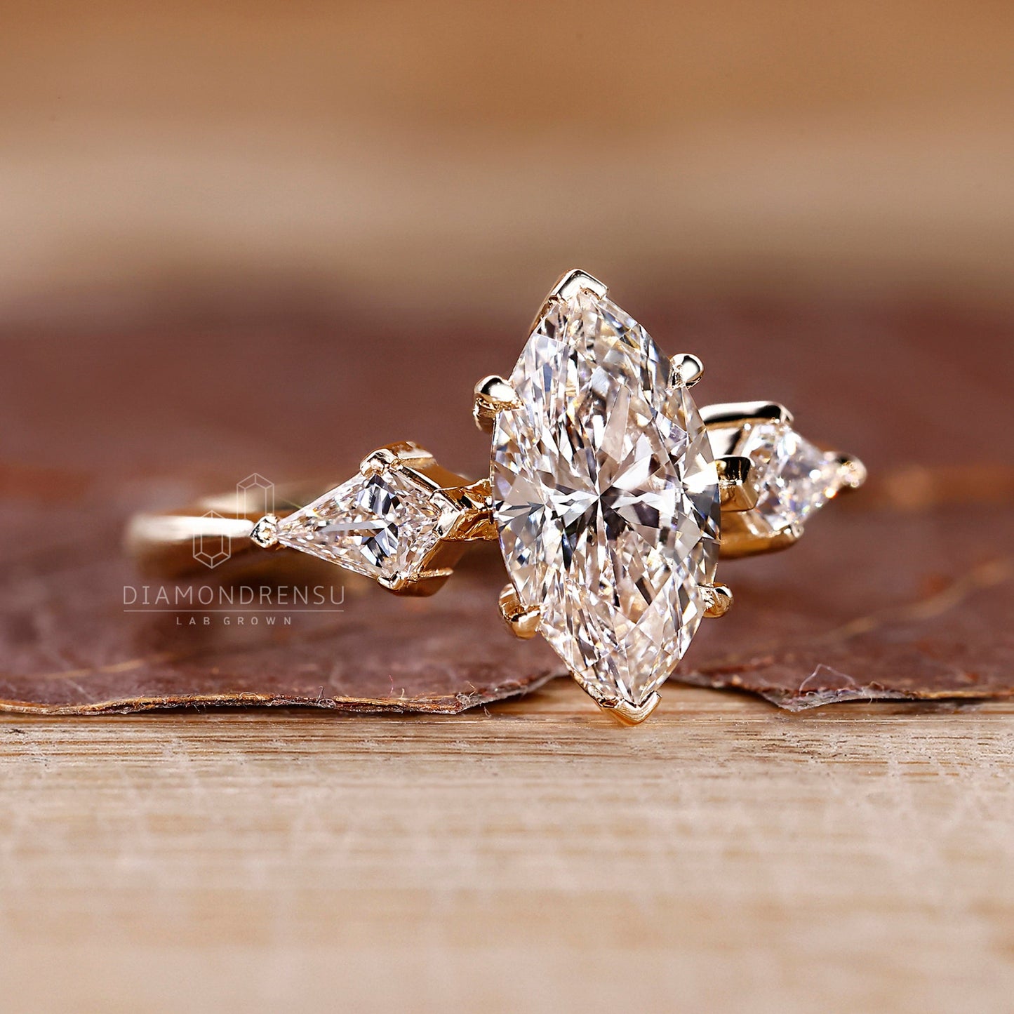 Marquise and Kite Cut Three Stone Engagement Ring