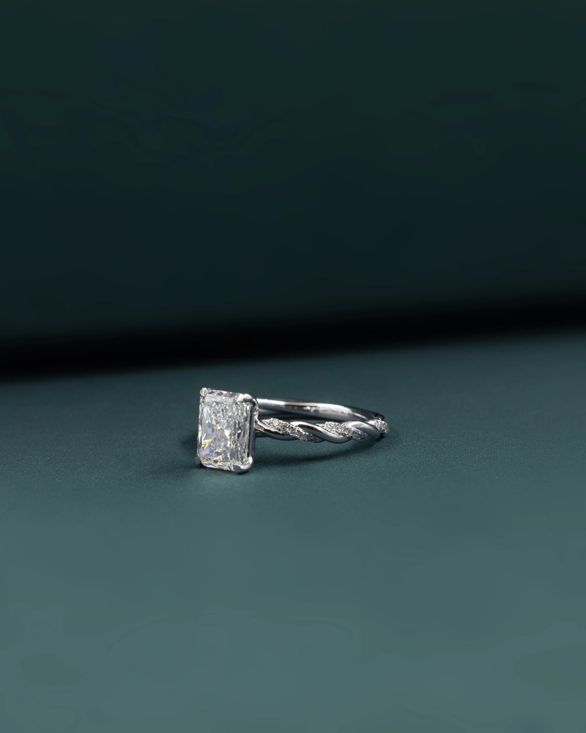 2.16 CTW Emerald Cut Lab-Grown Diamond Twisted Pave Solitaire Ring