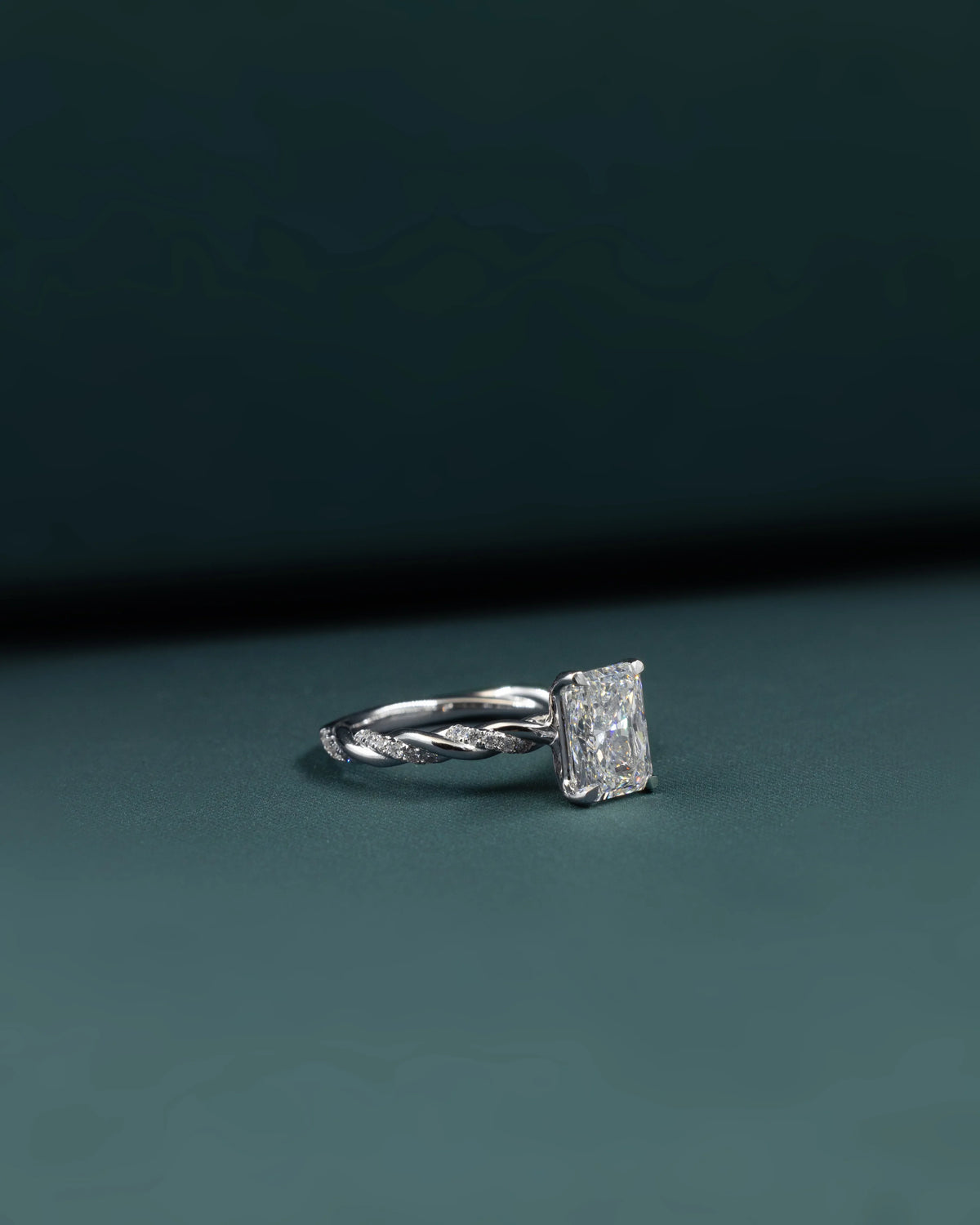 2.16 CTW Emerald Cut Lab-Grown Diamond Twisted Pave Solitaire Ring