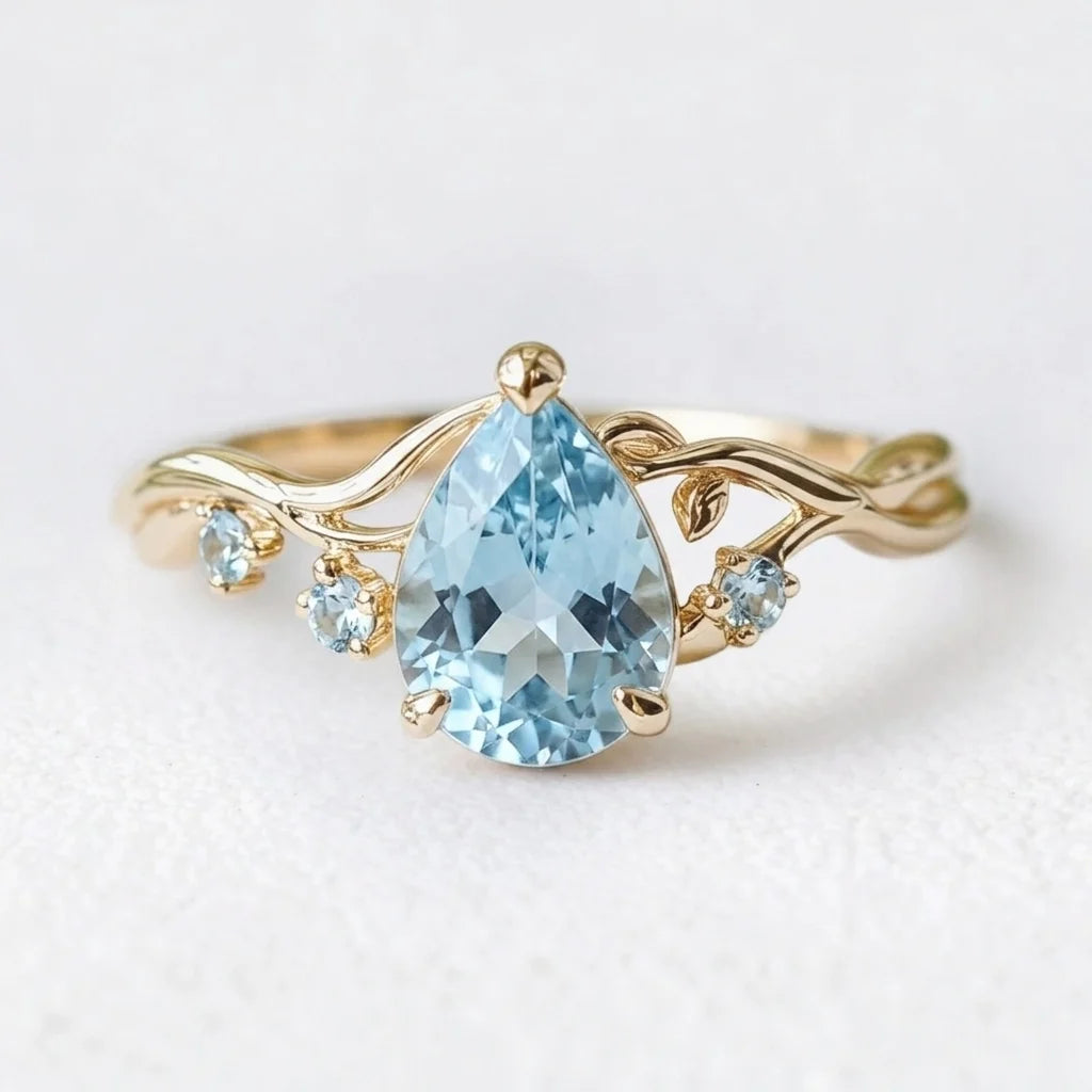 Athena’s Serenity | Pear Cut Blue Aquamarine Engagement Ring
