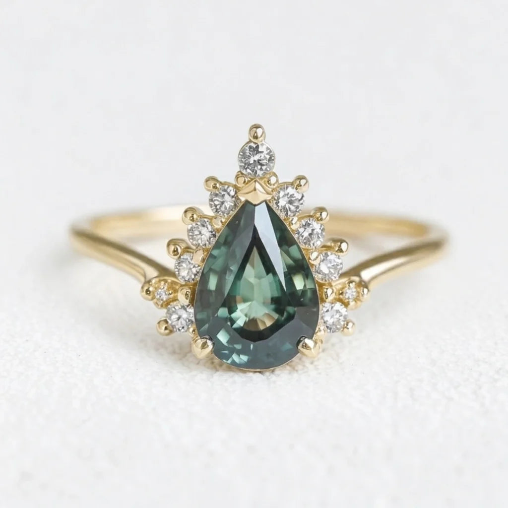 Mermaid’s Crown | Pear Teal Sapphire Halo Engagement Ring