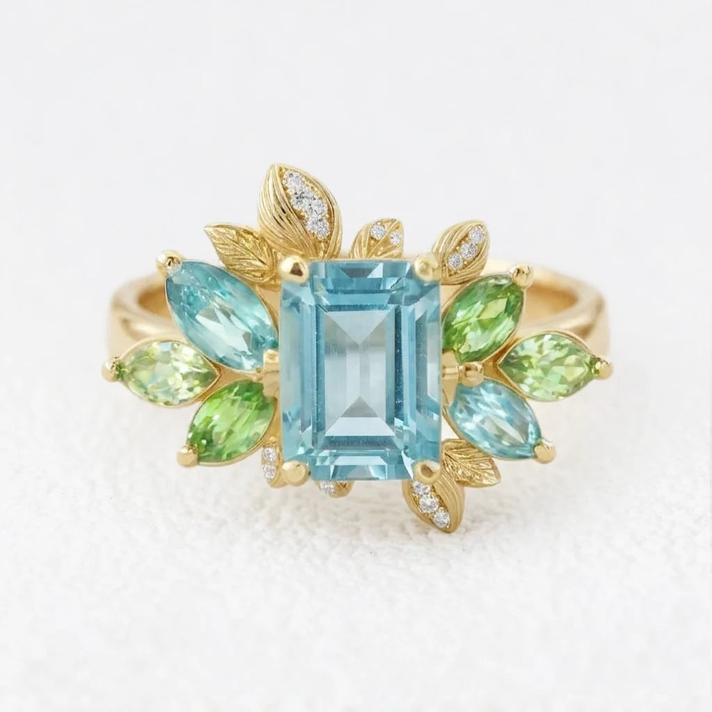 Celeste’s Bloom | Emerald Cut Blue Topaz Leafy Engagement Ring