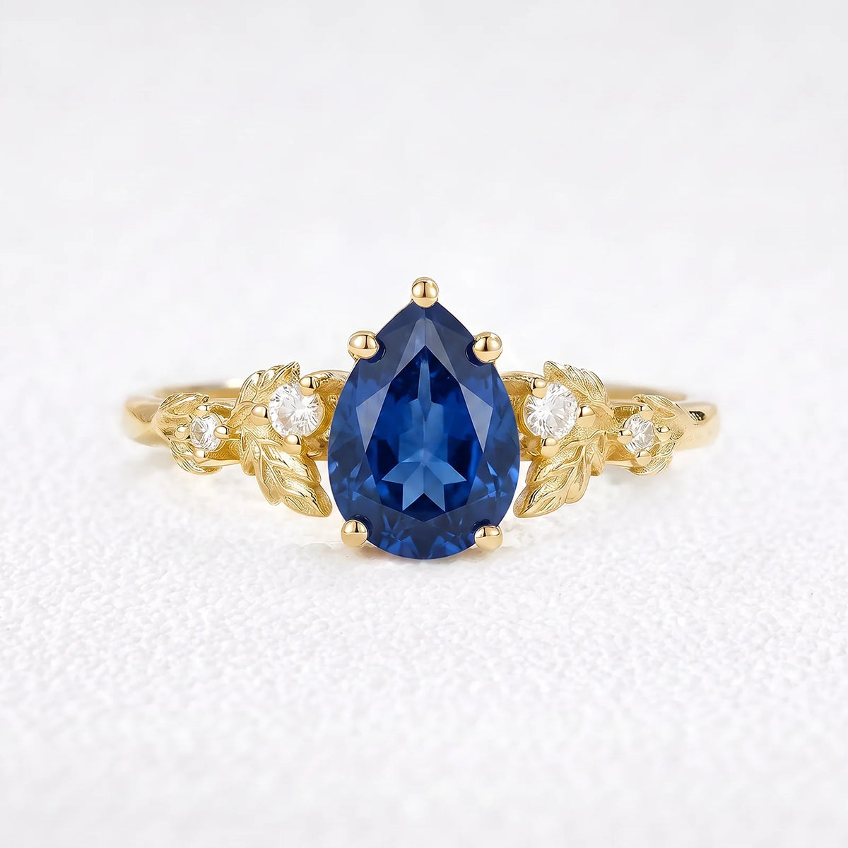 Daisy’s Twilight | 1.5CT Pear Cut Blue Sapphire Engagement Ring