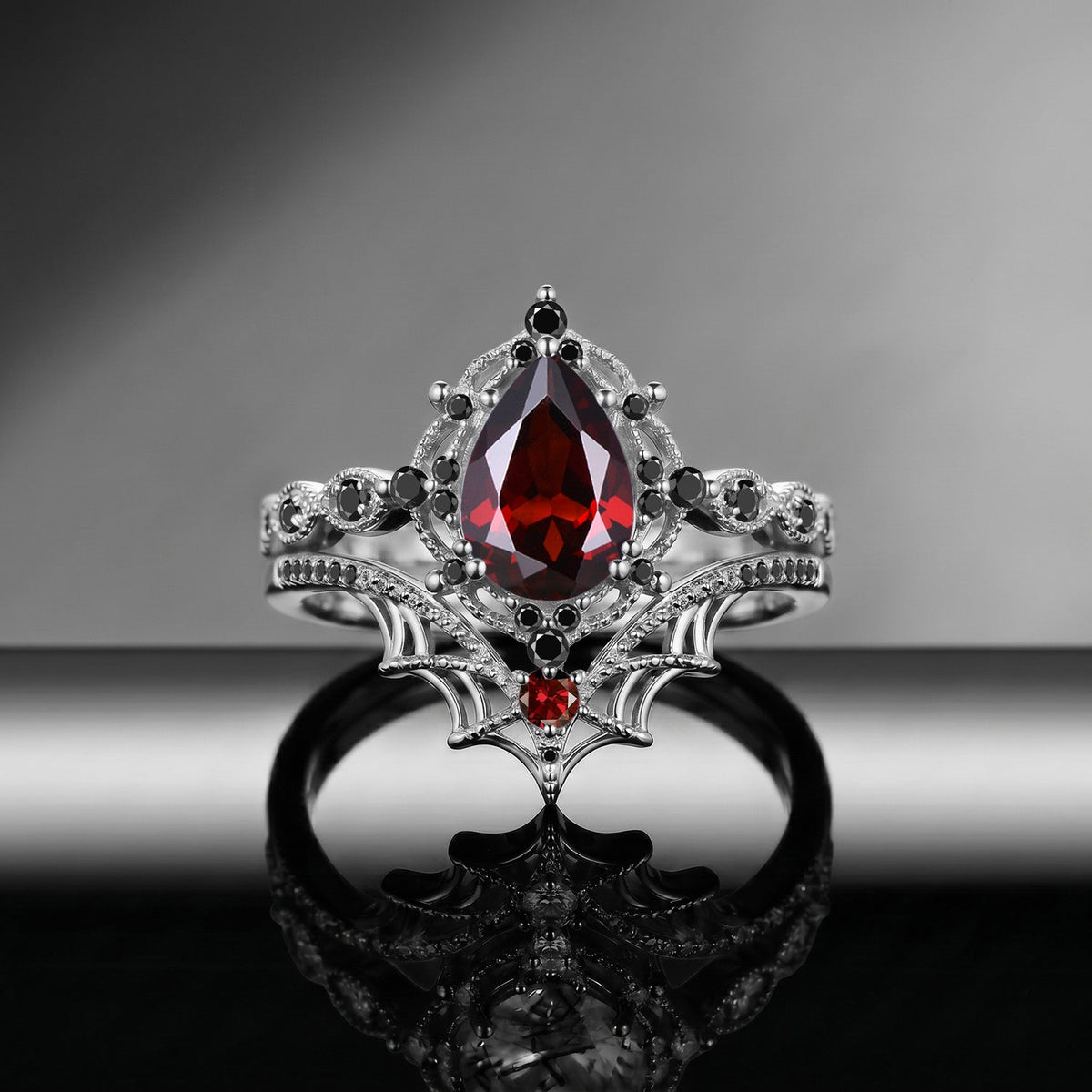 Spider Ring 'Web of Love' – Gothic Pear Cut Garnet Engagement Ring Set with Spider Web Inspired Milgrain Band