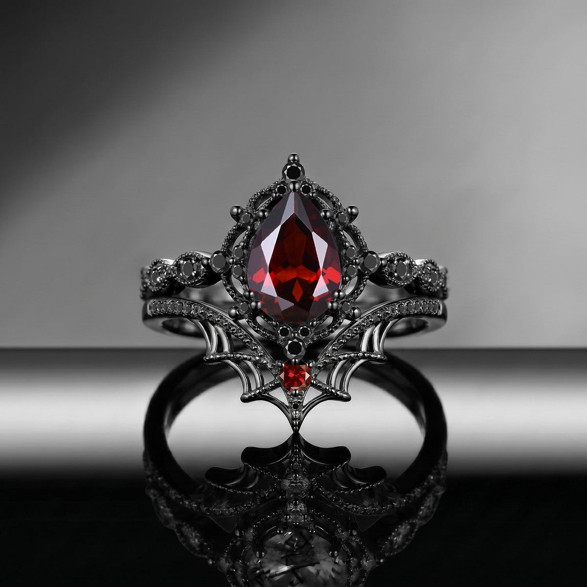Spider Ring 'Web of Love' – Gothic Pear Cut Garnet Engagement Ring Set with Spider Web Inspired Milgrain Band
