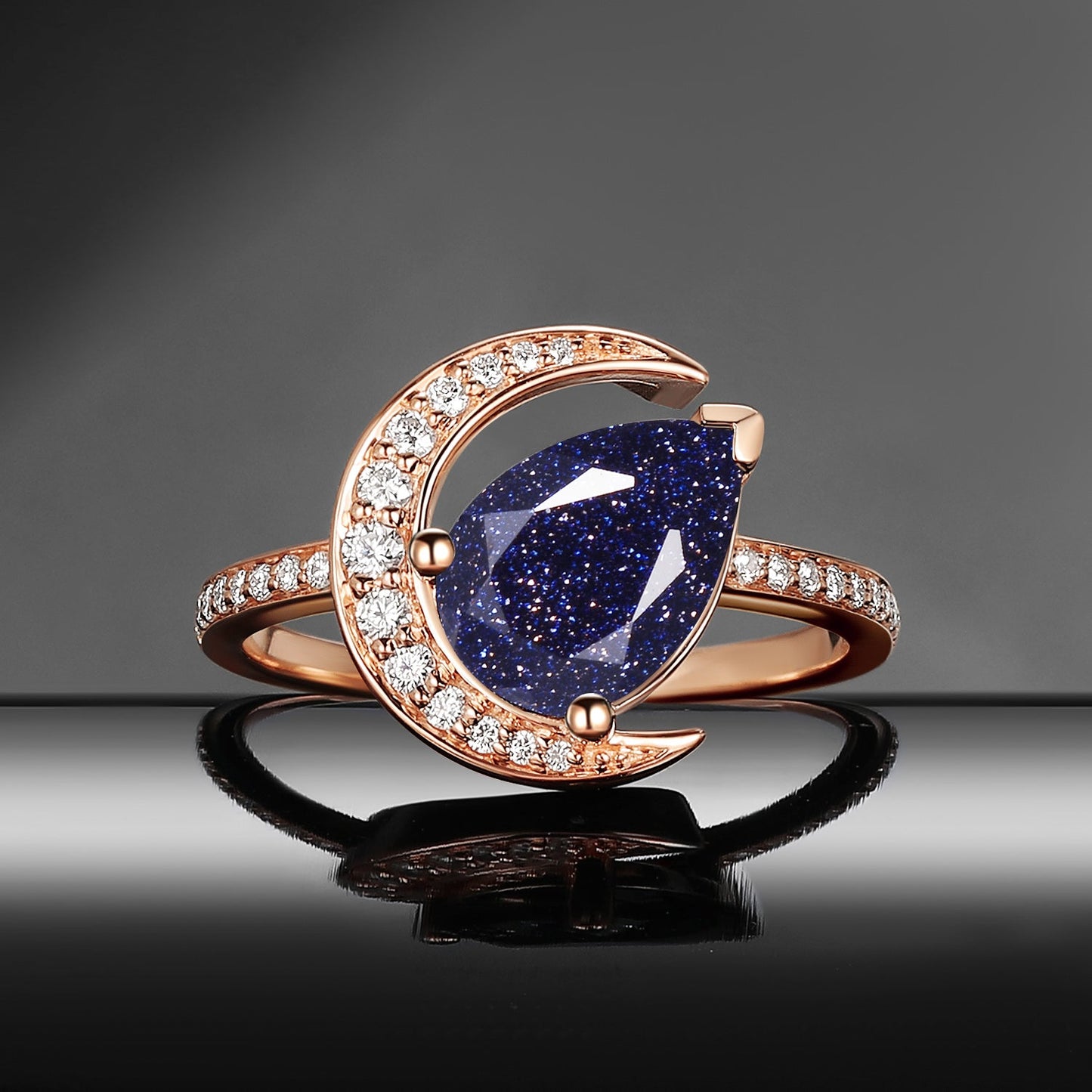 'Moonlit Reverie' - Tilted Pear Cut Blue Sandstone Crescent Moon Engagement Ring