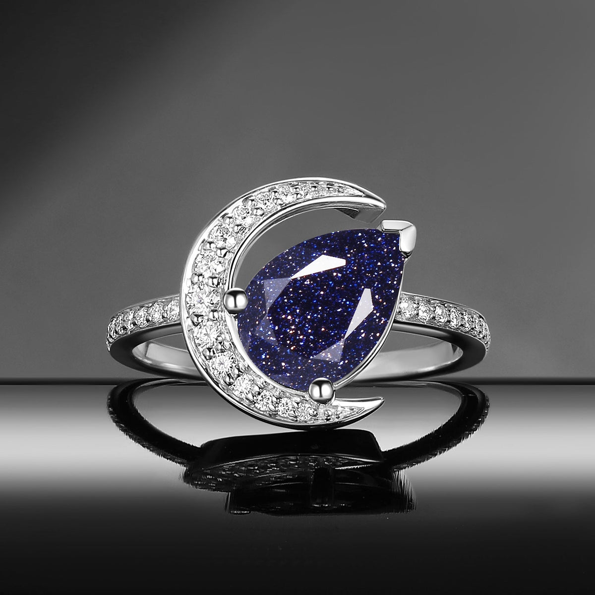 'Moonlit Reverie' - Tilted Pear Cut Blue Sandstone Crescent Moon Engagement Ring