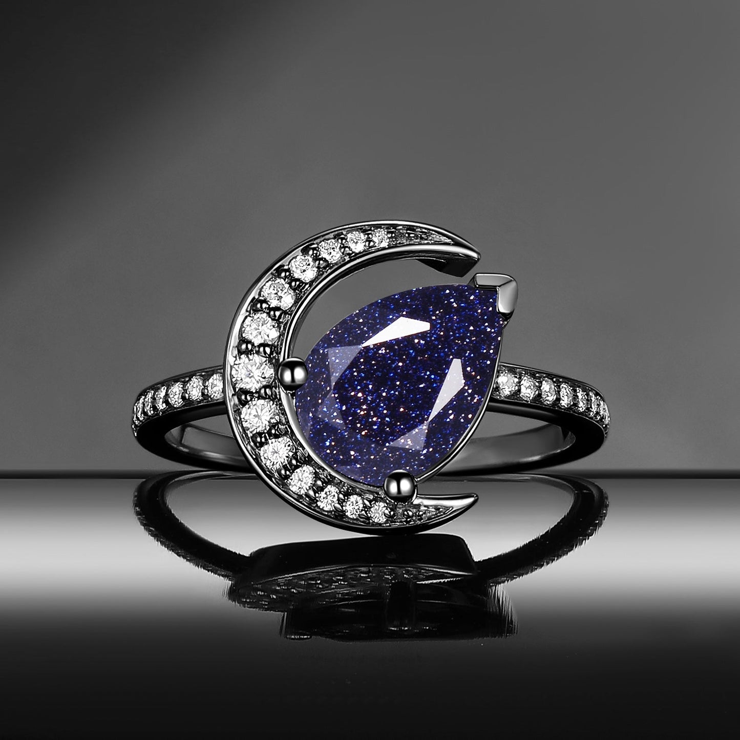 'Moonlit Reverie' - Tilted Pear Cut Blue Sandstone Crescent Moon Engagement Ring