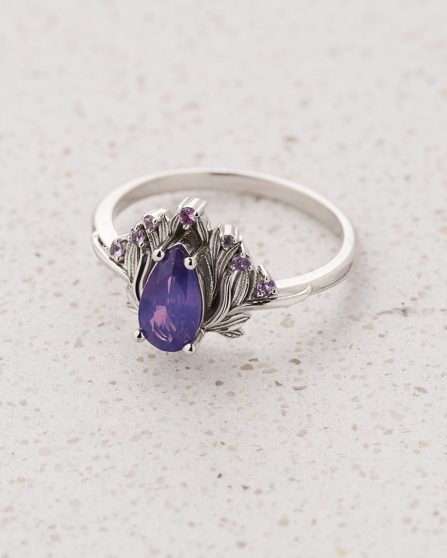 Flower-inspired Engagement Ring with Pear-Cut Opalescent Purple Sapphire and Accent Sapphires / Iris