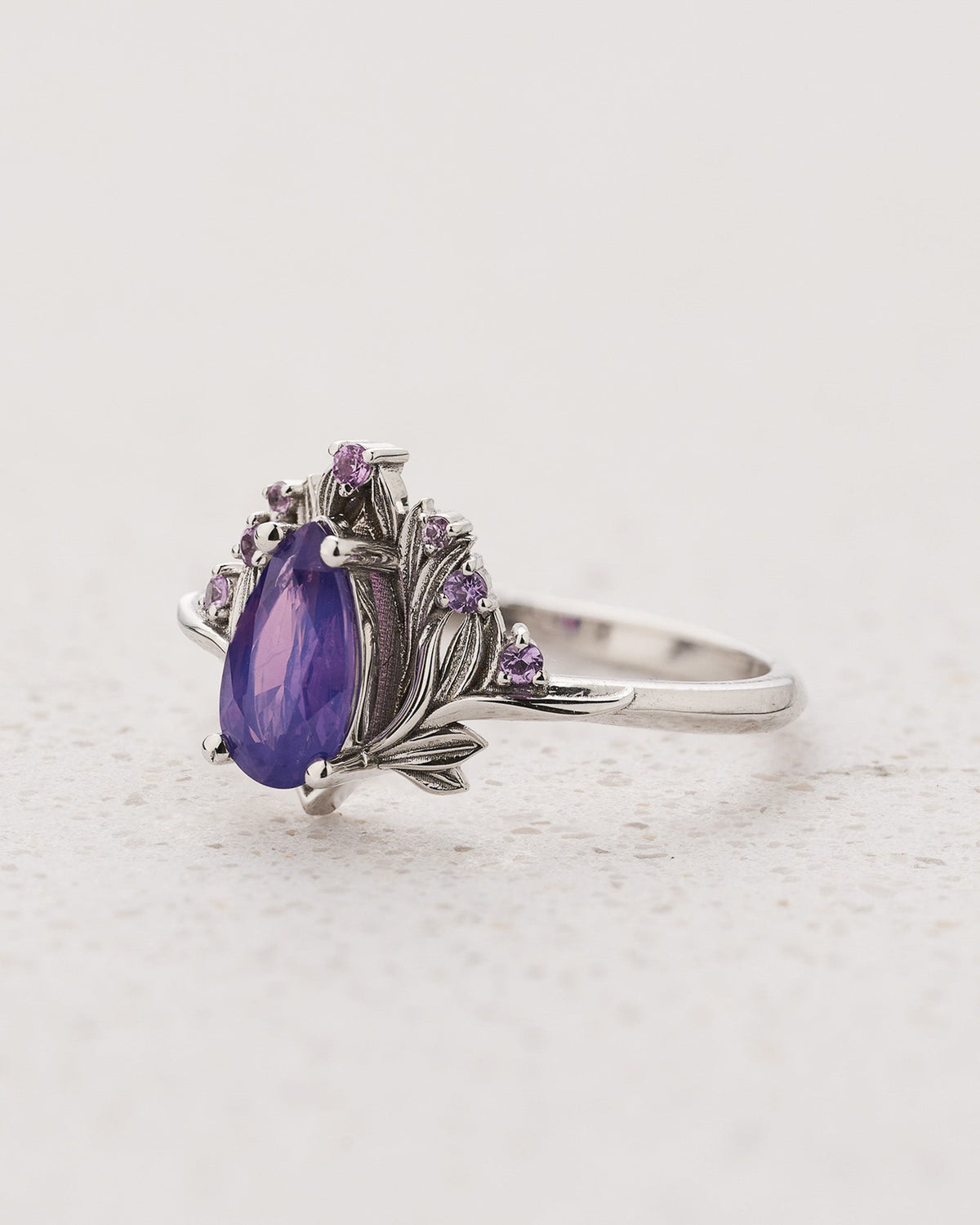 Flower-inspired Engagement Ring with Pear-Cut Opalescent Purple Sapphire and Accent Sapphires / Iris
