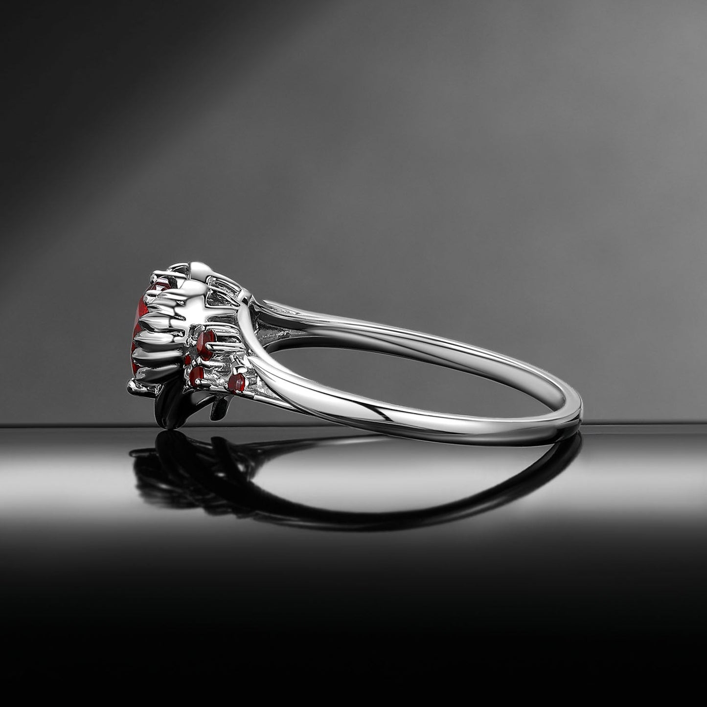 Heart & Sword 'Pierced Heart' – Gothic Garnet Engagement Ring with Angel Wing Detail