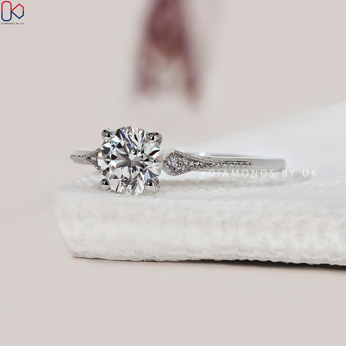 Round Diamond Side Stone Engagement Ring