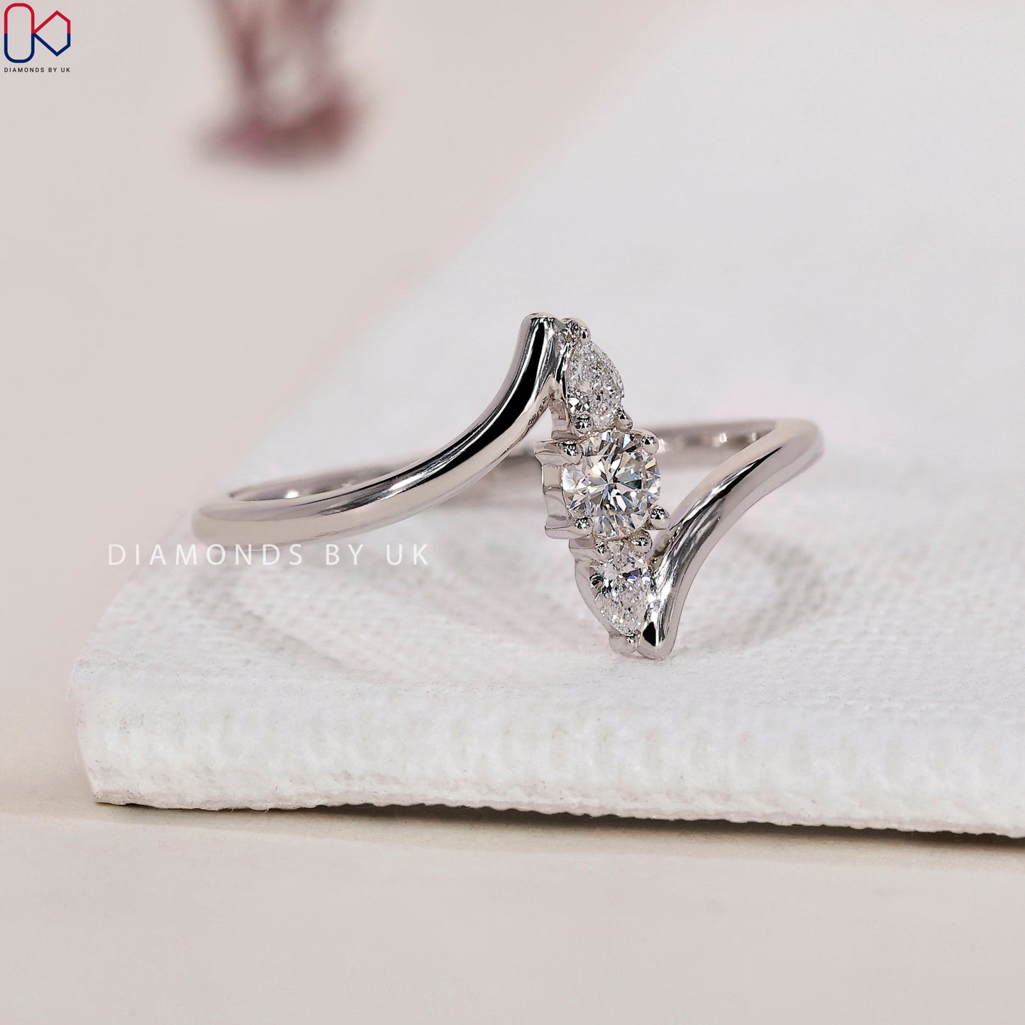Round and Pear 3 Stone Diamond Ring