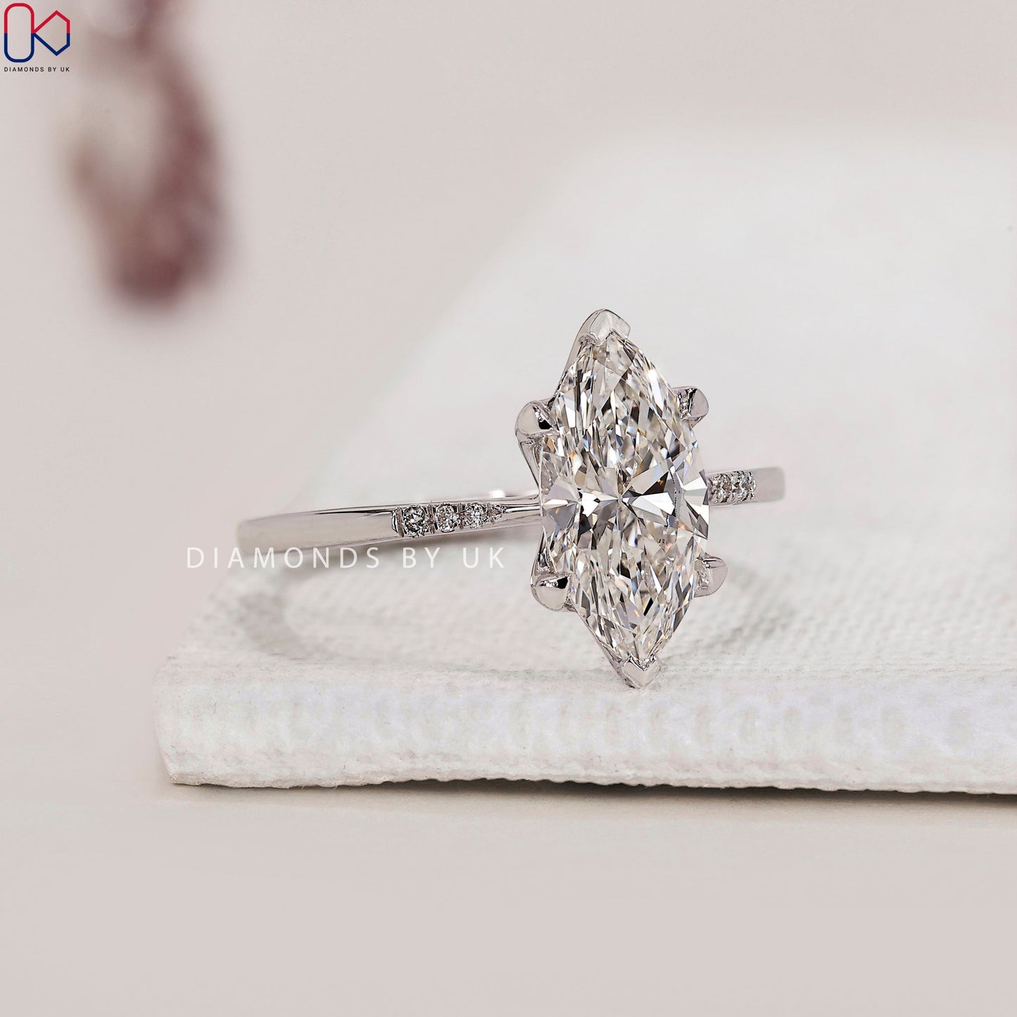 Marquise Diamond Engagement Ring with Round Side Accents