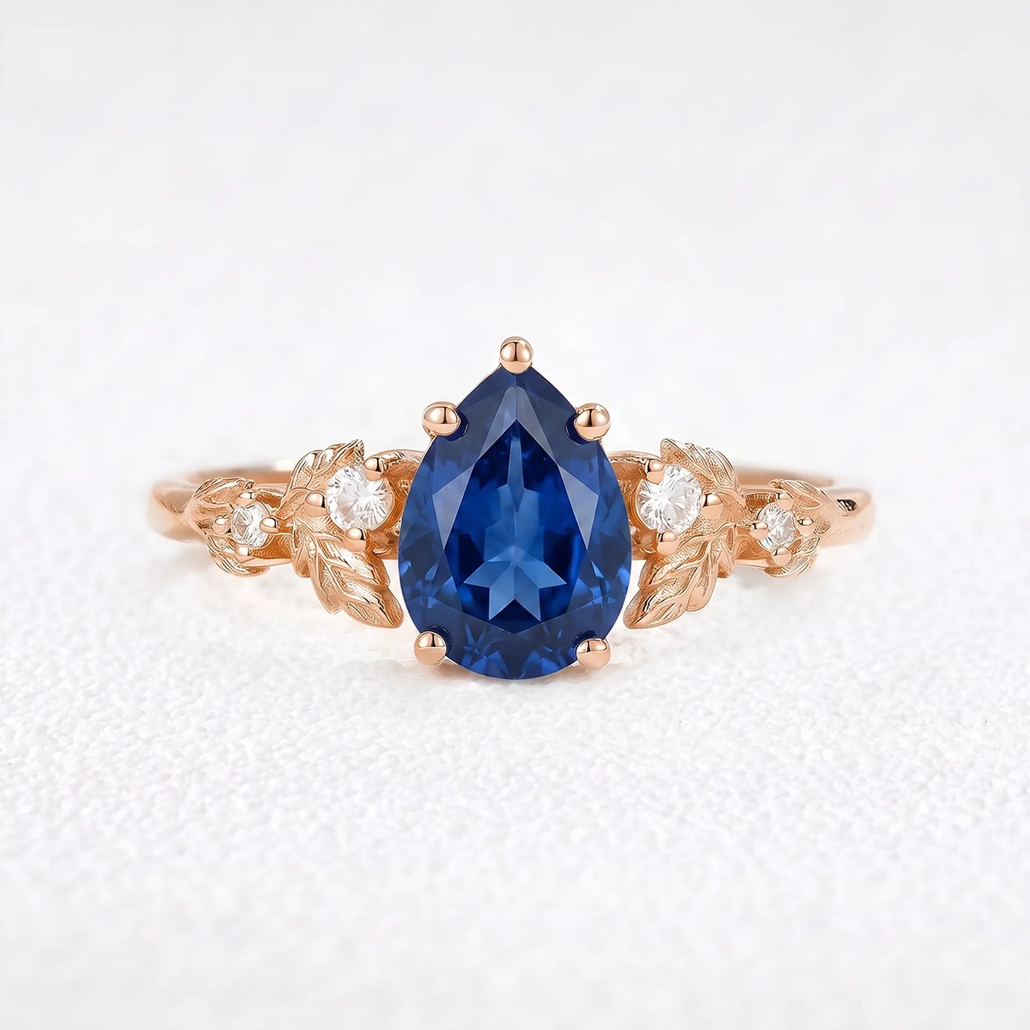 Daisy’s Twilight | 1.5CT Pear Cut Blue Sapphire Engagement Ring