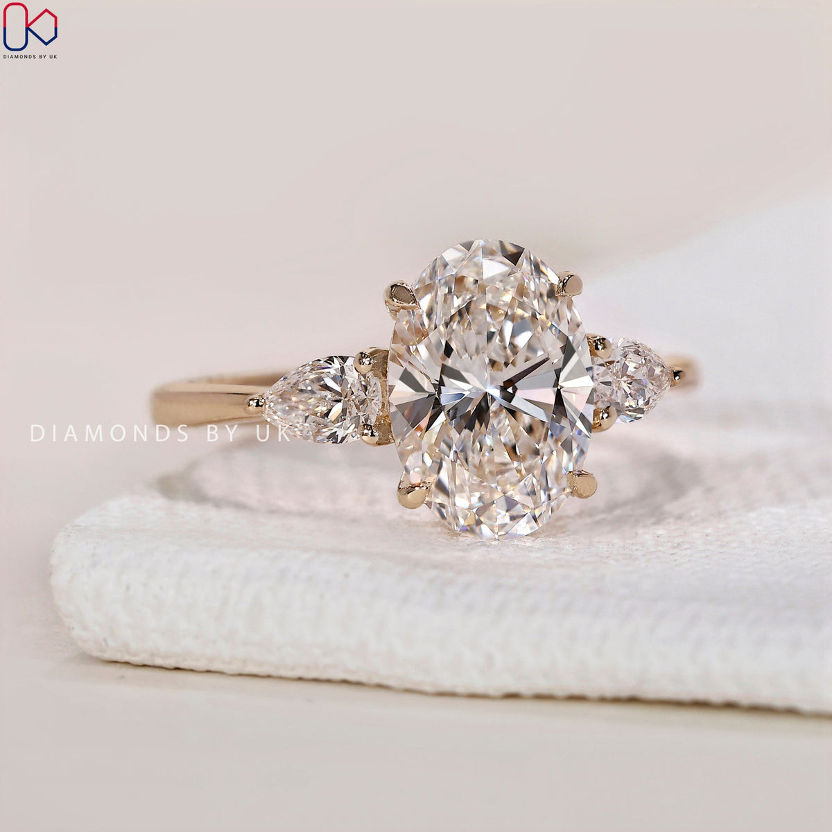 3 Stone Engagement Ring - Oval and Pear Diamond