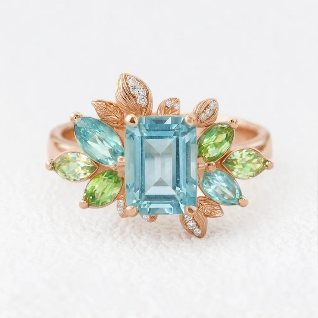 Celeste’s Bloom | Emerald Cut Blue Topaz Leafy Engagement Ring