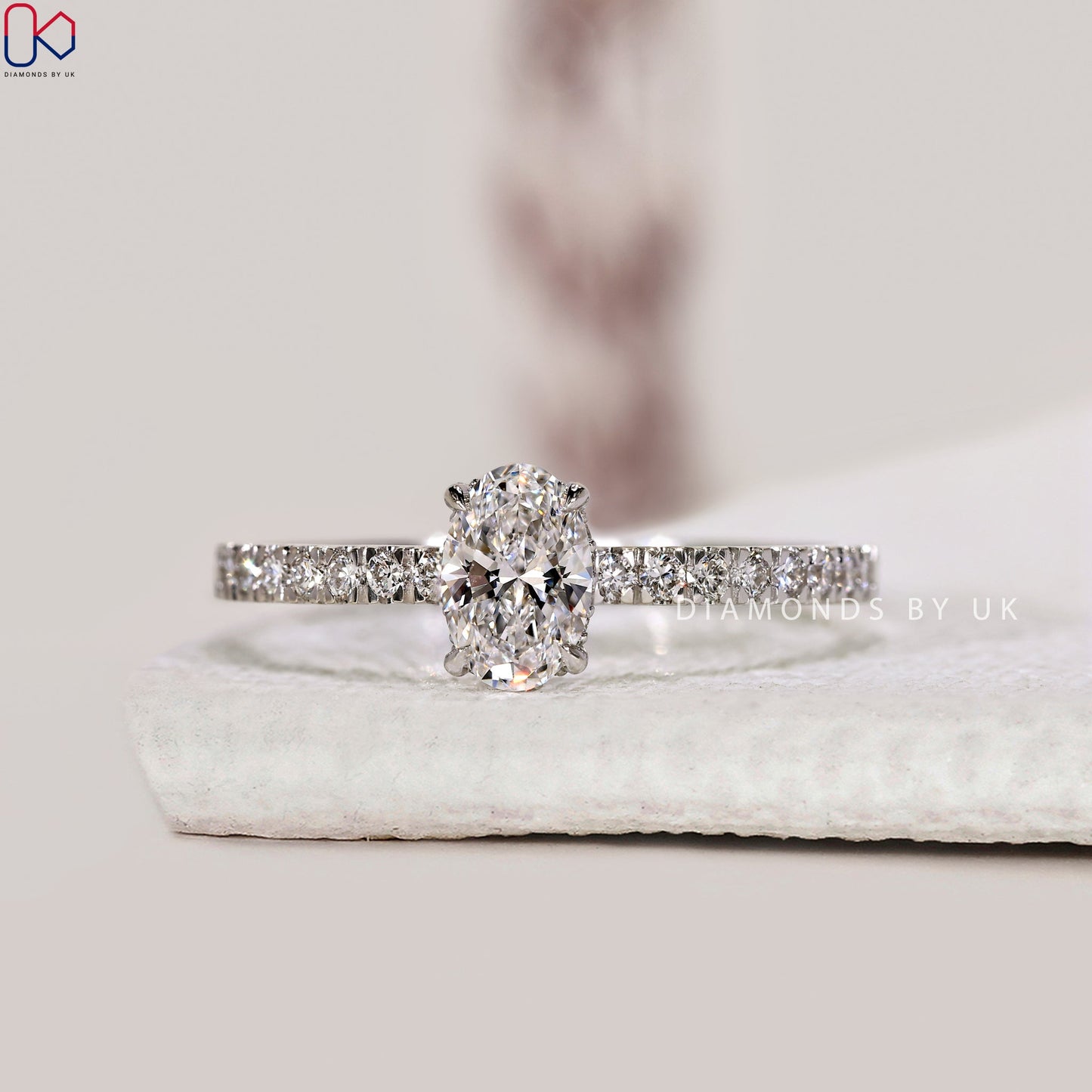 Gold Oval Diamond Engagement Ring In Pave Setting