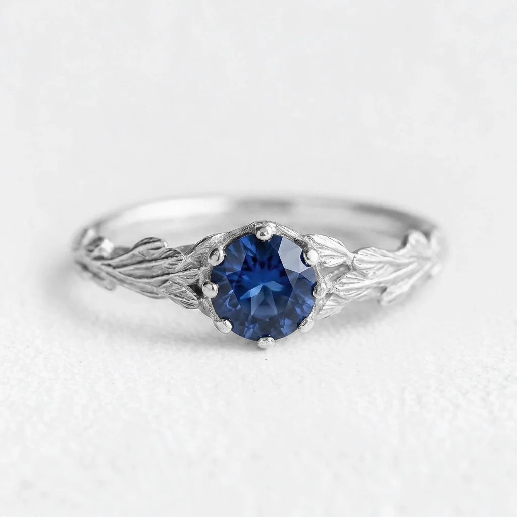 Athena’s Wisdom | Round Blue Sapphire Olive Branch Engagement Ring